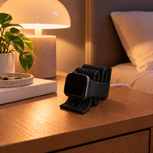 Apple Watch Charging Stand in Black on a bedside table