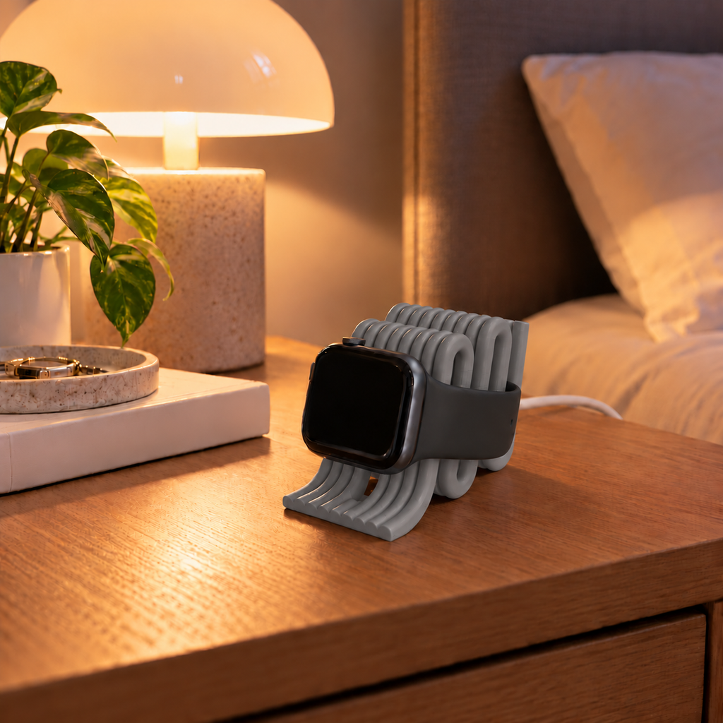 Apple Watch Charging Stand in Grey on a bedside table