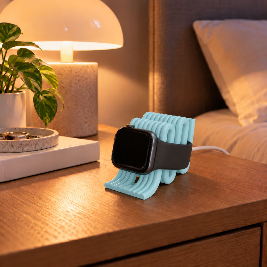 Apple Watch Charging Stand in Ice Blue on a bedside table