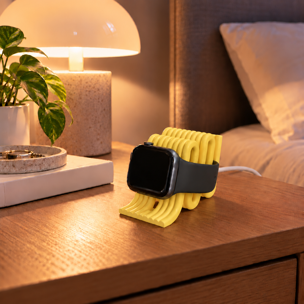 Apple Watch Charging Stand in Yellow on a bedside table